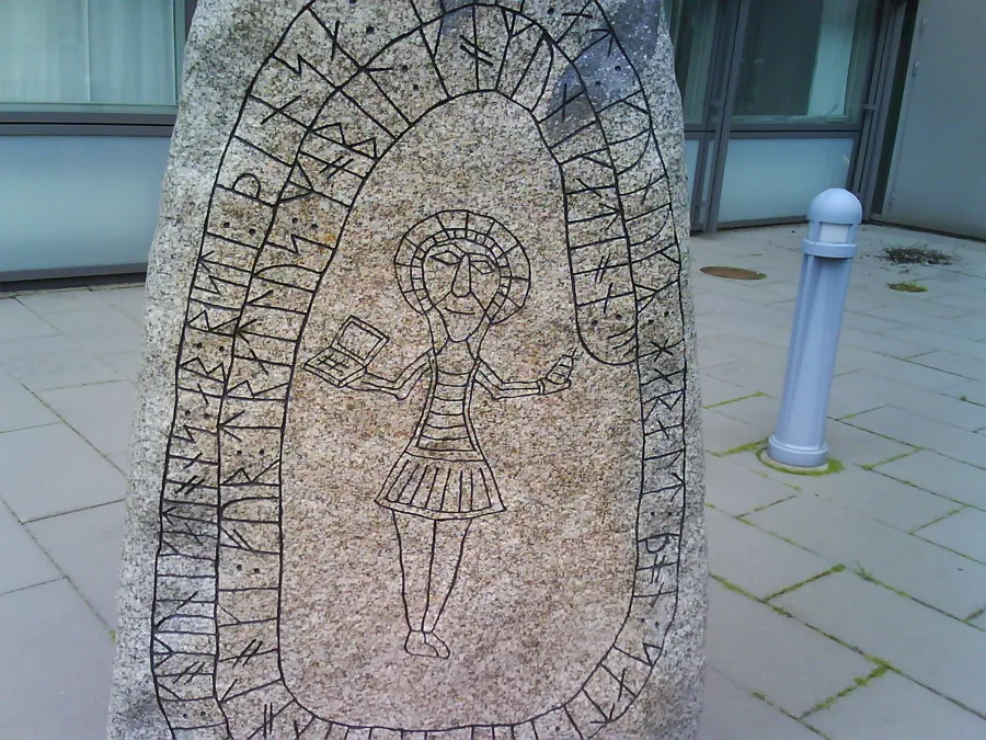 The Bluetooth runestone Ericsson raised in Lund (1999): a man holding a laptop and a phone